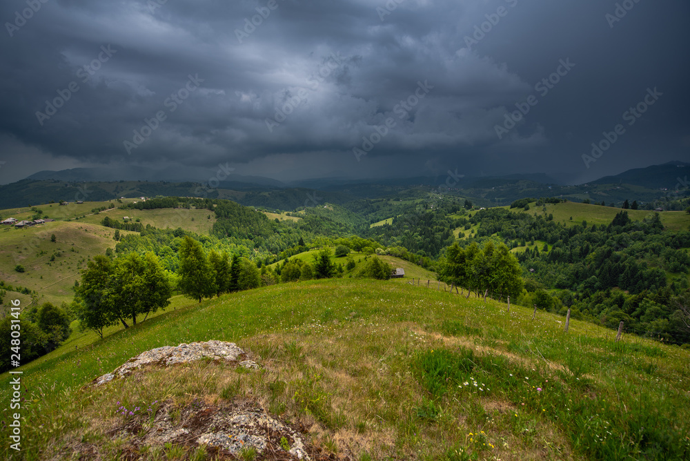 Storm clouds over Transylvania landscape in summer time , Romania 