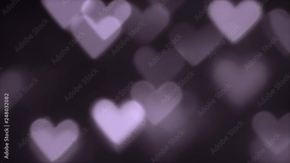 Heart-shaped defocused bokeh light background Heart-shaped defocused bokeh light background