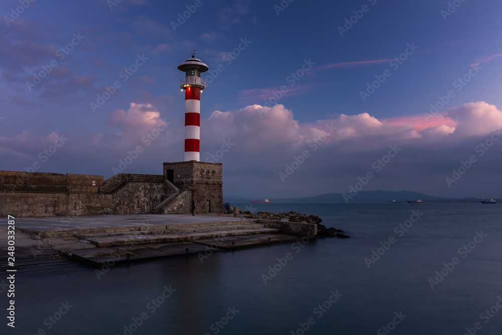 Lighthouse at sunset in port Burgas, Black Sea, Bulgaria.
