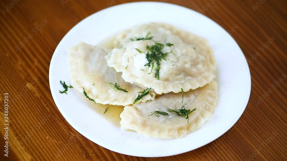 Boiled dumplings stuffed in a plate, Ukrainian national dish. Boiled dumplings stuffed in a plate, Ukrainian national dish.