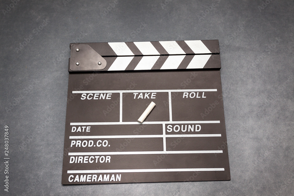 Movie clapper board on gray background - film concept