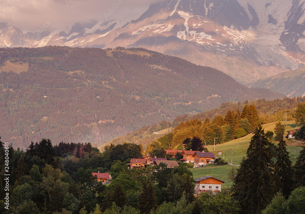 Naklejka premium Dawn Alps mountains France, snowy peaks in fog, summer sunset Chamonix Mont Blanc France