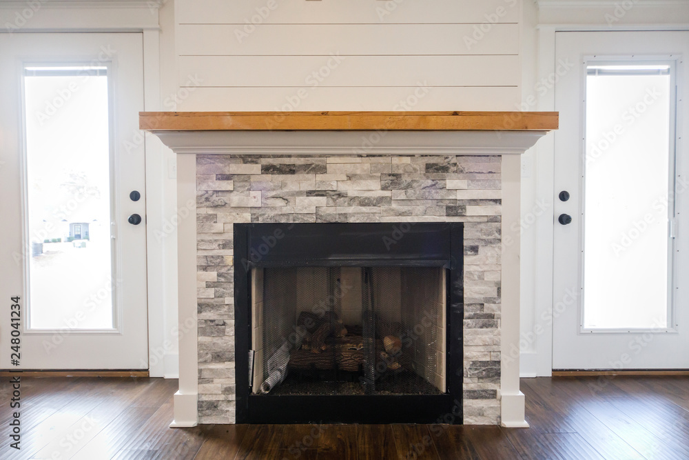 Modern Open Spacious Living Room With Tiled Fireplace and Custom Mantle and Dark Wood Floors Modern Open Spacious Living Room With Tiled Fireplace and Custom Mantle and Dark Wood Floors