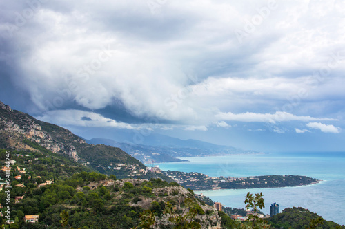 View from La Turbie to Monaco, Cape Martin and Italy, stormy clouds and rain in Italy, La Turbie, France