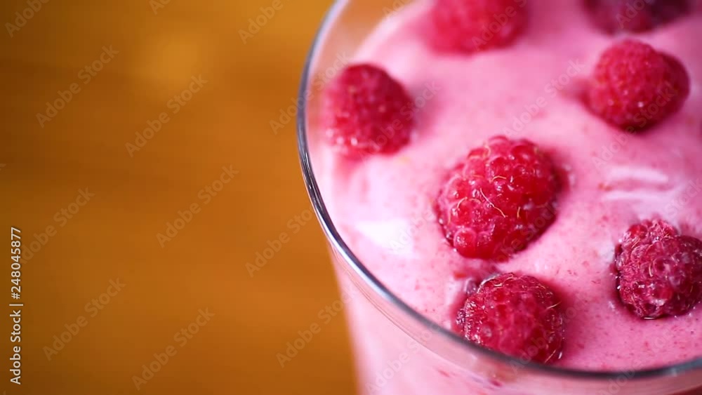 sweet organic smoothie with raspberry on wooden sweet organic smoothie with raspberry on wooden