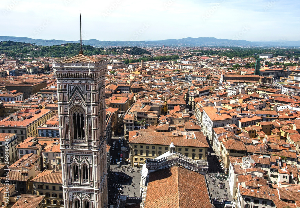 bell tower of cathedral Santa Maria del Fiore with roofs of old town, Florence, Italy