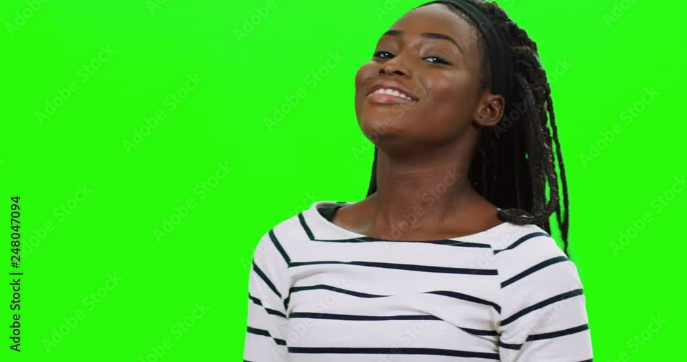 Close up of the young attractive African American woman waving her hair ...
