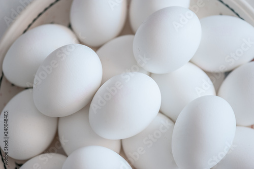 White eggs on a plate. Organic village eggs. Close up  soft focus  top view.