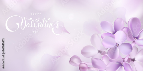 Happy Valentines day background with lilac flower petals and lettering.