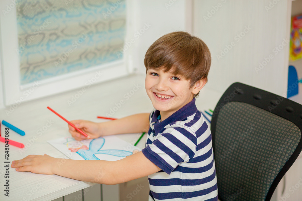 child draws at the table child draws at the table