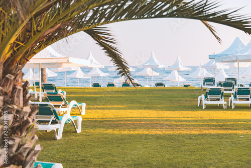 Beach view with blue sea and umbrellas photo