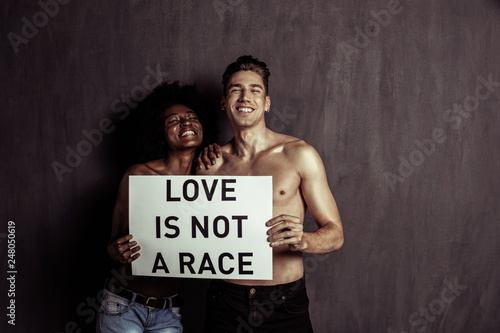 Happy multiethnic young couple showing their love