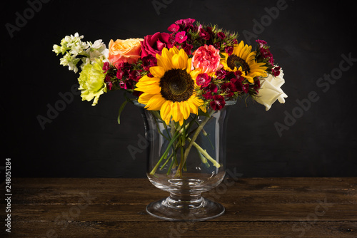 Wallpaper Mural Bouquet of white yellow and red flowers in a vase on a dark background Torontodigital.ca