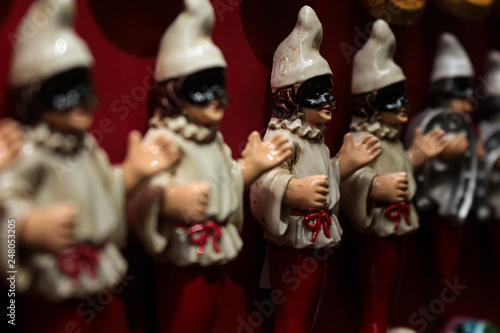 Little dolls with hat and mask of the Venetian carnival. Carnival celebration in Italy.