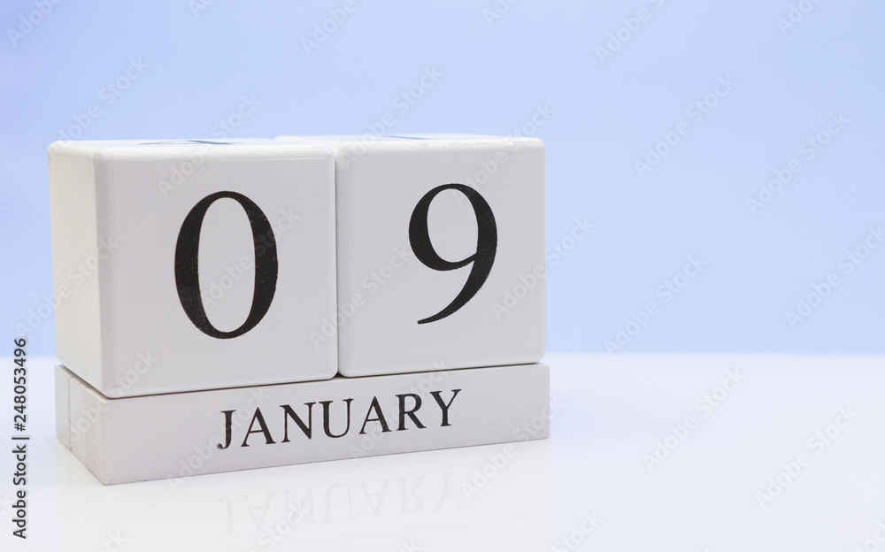 January 09st. Day 09 of month, daily calendar on white table with reflection, with light blue background. Winter time, empty space for text January 09st. Day 09 of month, daily calendar on white table with reflection, with light blue background. Winter time, empty space for text