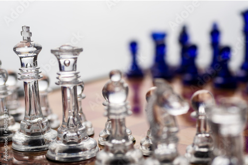 Chess pieces closeup, with out of focus background, dark and white pieces
