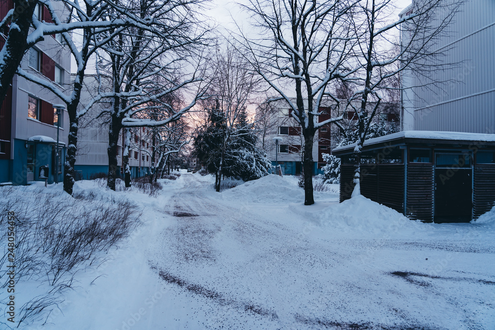 Walking though the suburbs with concrete panel houses on a winter day Walking though the suburbs with concrete panel houses on a winter day