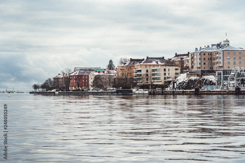 Older apartment houses at the coast of Helsinki Finland on a cold winter day