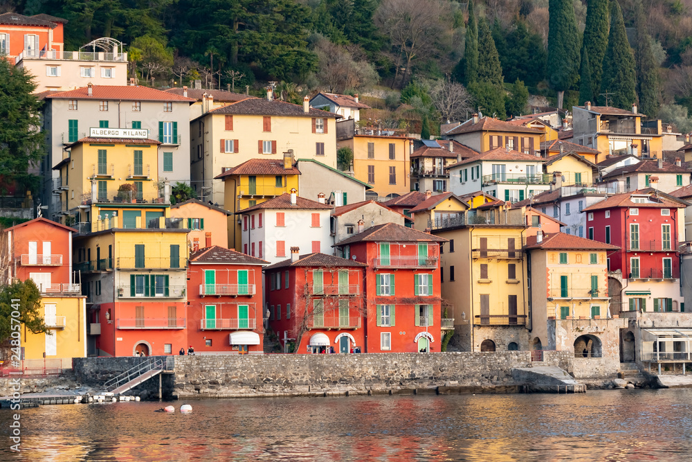 View of many color buildings in beautiful village Varenna, Como lake, Italy