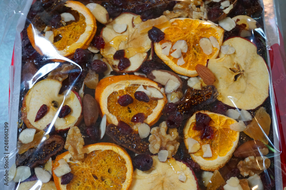Fototapeta premium Delicious fruit cake with dried baked orange apple plum slice on top Christmas traditional foo sweet dessert homemade cake beautiful decoration food 
