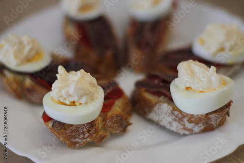 home made spanish traditional snack pintxos with anchovy and egg 