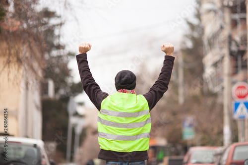 yellow vest political activist protesting on street