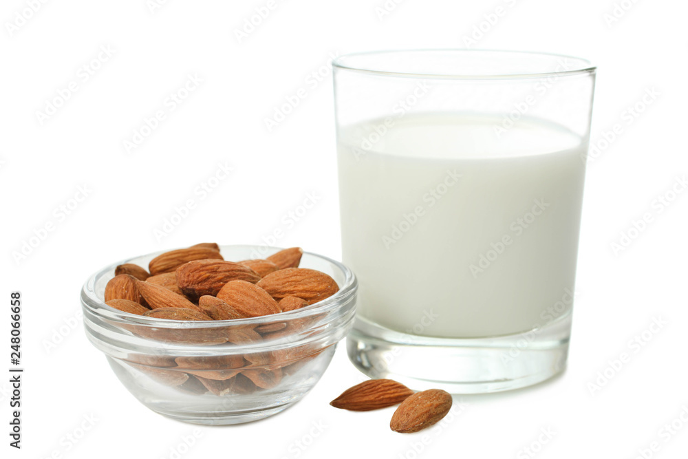 Glass cup of milk and almond nuts Glass cup of milk and almond nuts