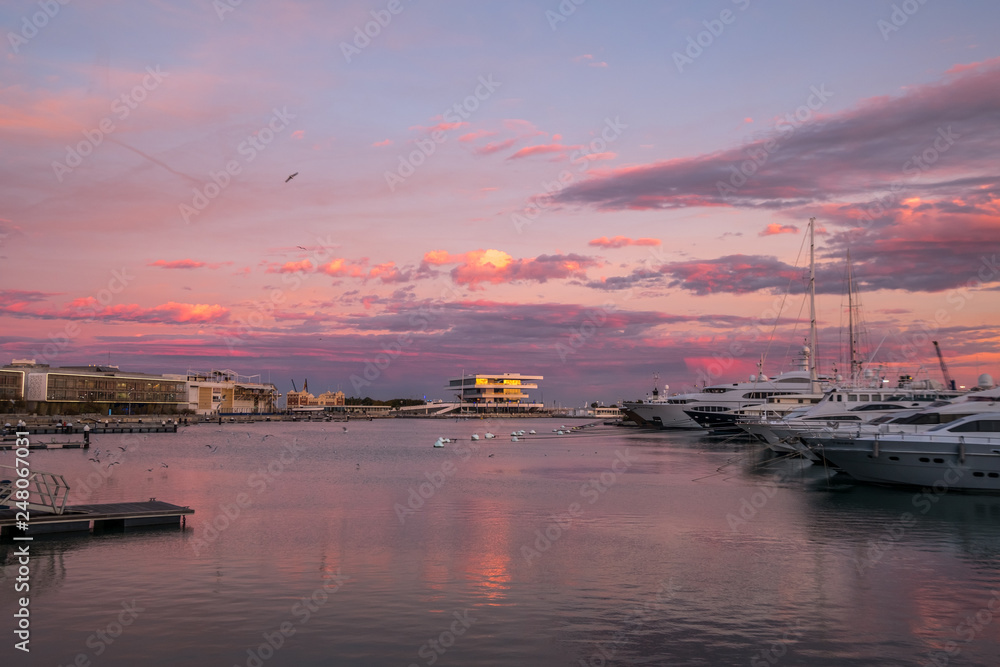 sunrise at the Valencia harbor, Spain Sunset at the port of Valencia, Spain colors in the sky and water reflection
