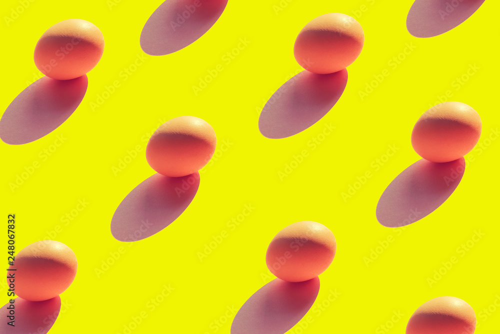 Pattern of eggs on a yellow background top view of Flat lay