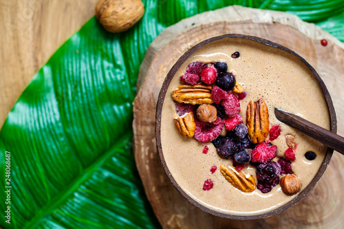 Chocolate smoothie with frozen berries and nuts