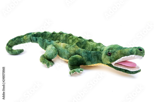 Green soft stuffed toy Crocodile isolated on white background.