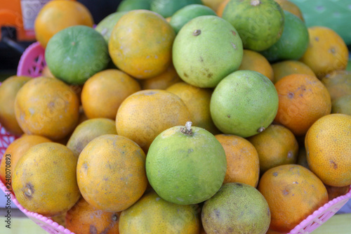 green and yellow Lime in the pink basket