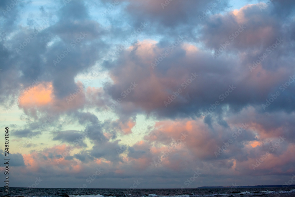 beautiful sunset view over the sea with bright colorful clouds