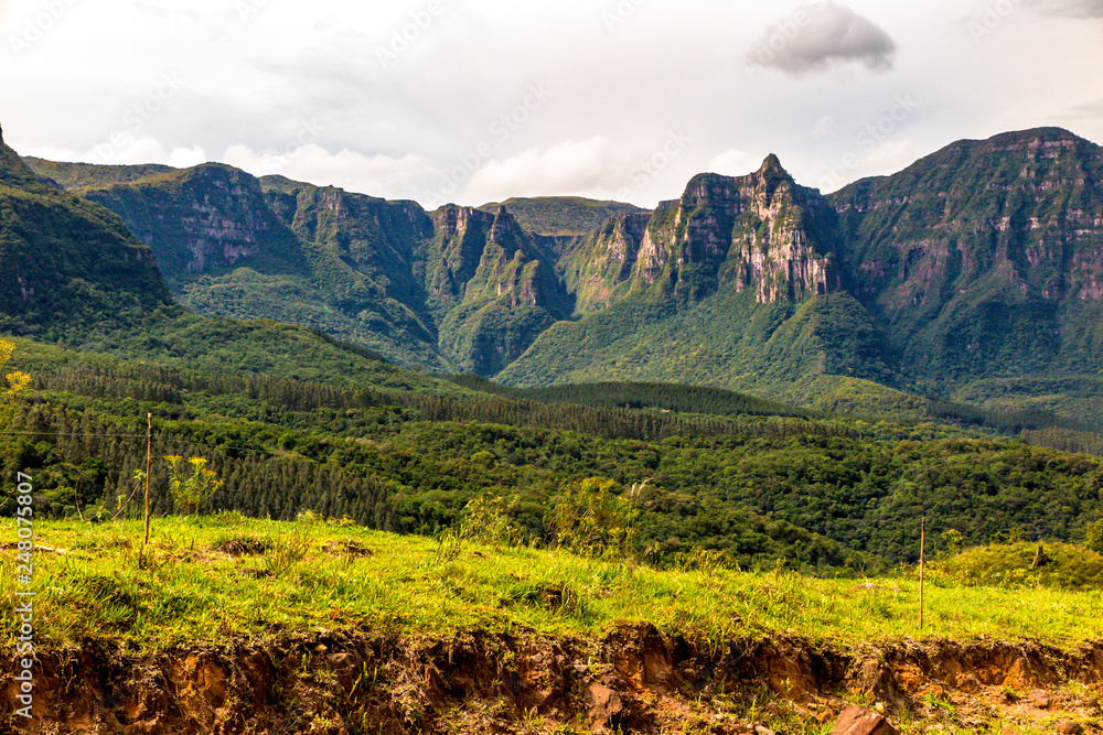 Naklejka premium View of the walls of the Espraiado Canyon from the Road of Corvo Branco, with dense forest ahead, Airue, Santa Catarina, Brazil