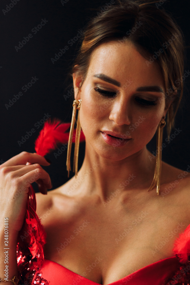 Fototapeta premium sexy girl in red dress.Girl on black background