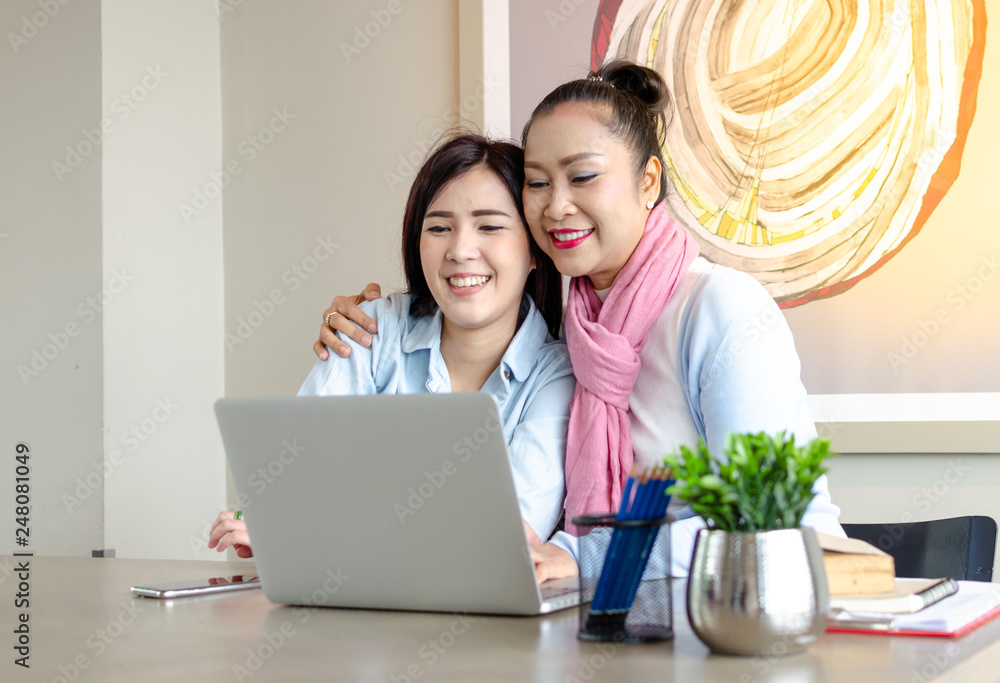 Daughter is teaching the elderly to study using the laptop. concept Senior couples use of laptop for digital online. Daughter is teaching the elderly to study using the laptop. concept Senior couples use of laptop for digital online.
