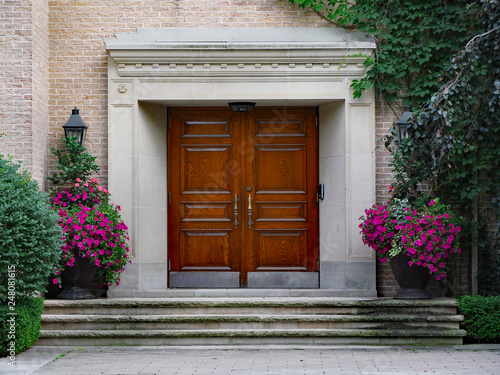 front door of large expensive house with elegant wooden double front door