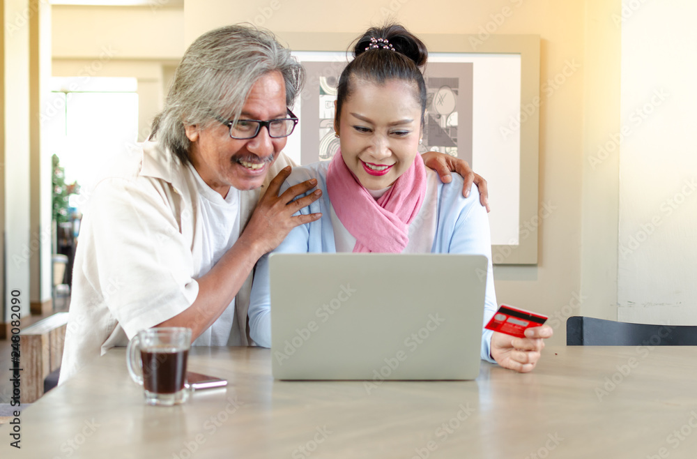 Senior couples studying the use of laptop. concept Senior couples use of laptop for digital online. Senior couples studying the use of laptop. concept Senior couples use of laptop for digital online.