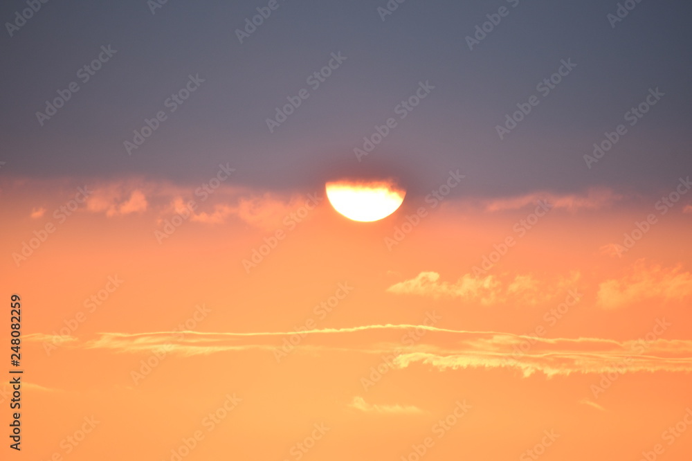 sunset over the sea fiery  sunset against a background of a provincial Italian town