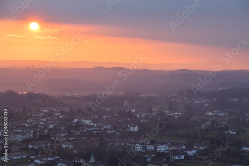 sunset over city fiery sunset against the background of a provincial Italian town