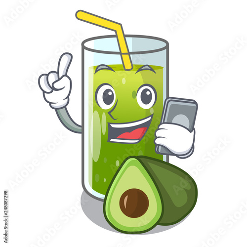 With phone avocado smoothies in a mascot glass