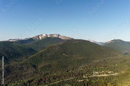 green mountain ridge scene with blue sky summer landscape background.