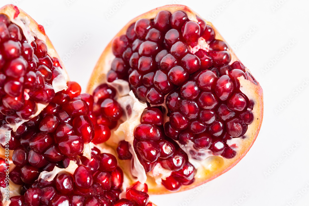 open pomegranate on a white background open pomegranate on a white background