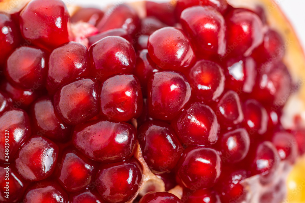 open pomegranate on a white background open pomegranate on a white background