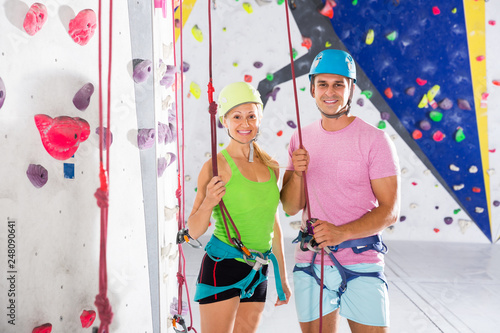 Couple posing before climbing workout