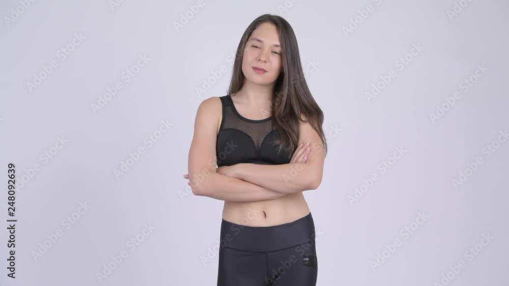 Young beautiful multi-ethnic woman with arms crossed ready for gym Young beautiful multi-ethnic woman with arms crossed ready for gym