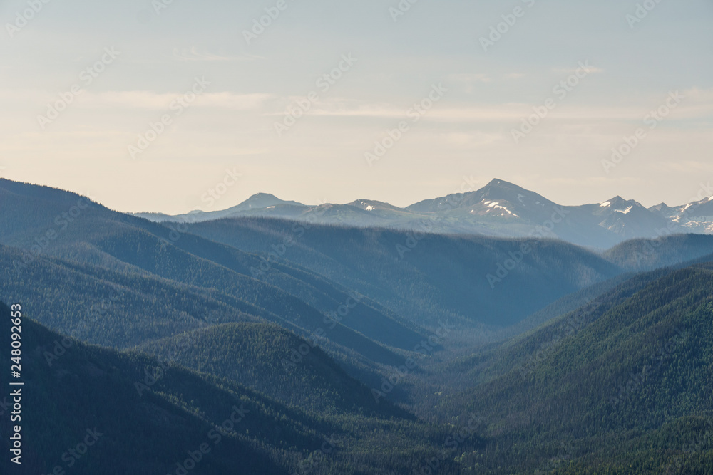 green mountain ridge scene with blue sky summer landscape background.