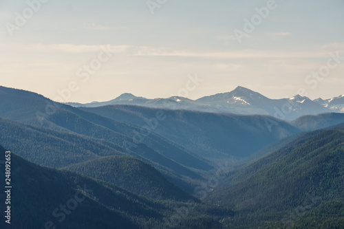 green mountain ridge scene with blue sky summer landscape background. © olegmayorov