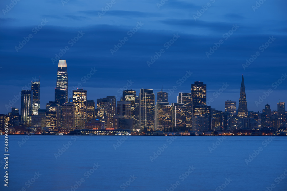 Downtown San Francisco skyline during evening blue hour.