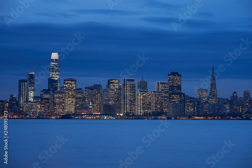 Downtown San Francisco skyline during evening blue hour.